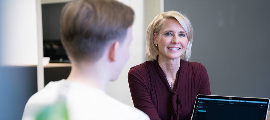 Woman from Traficom smiling during a conversation
