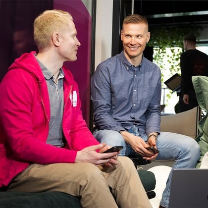 Two men sitting and talking