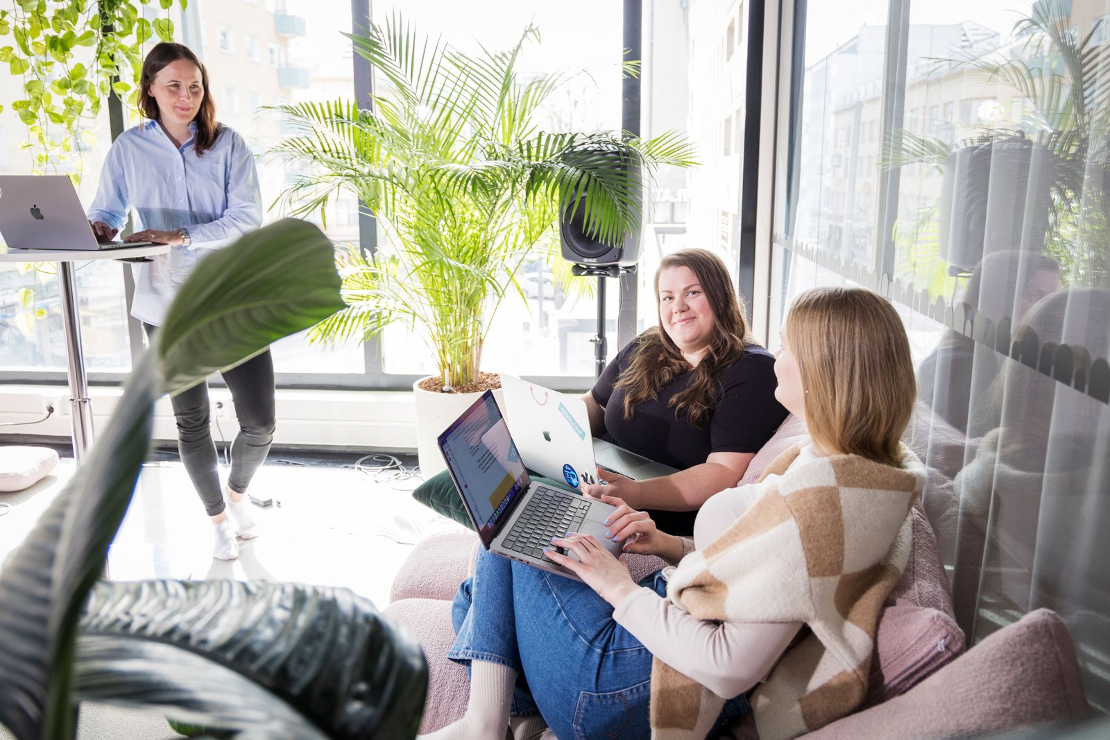 Three people working together in a modern office setting