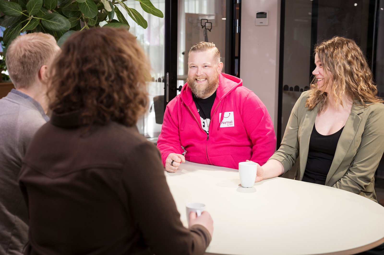 Group of people having a discussion around a table