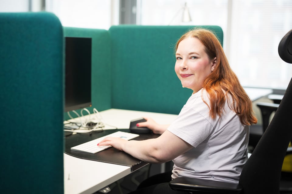 Smiling woman working at a desk