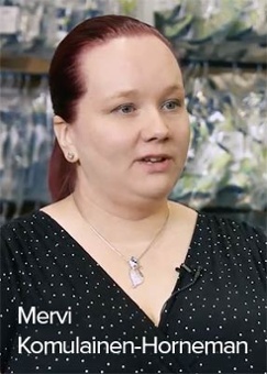 Mevi from Lumingerie in an interview, standing in front of warehouse shelves